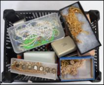 A large collection of costume jewellery to include necklace chains, bracelets, pearls, dress watchs,