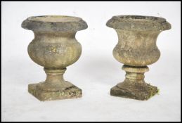 A near pair of 20th century marble campana urns,ea