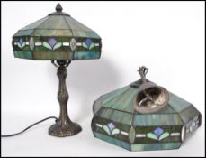 A contemporary stained and leaded glass table lamp with octagonal coloured glass shade together with