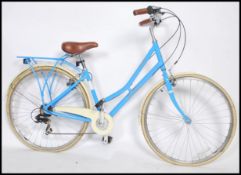 A Pendleton Somerby Womens Hybrid Bike in the manner of vintage beech cruiser style bike having 7