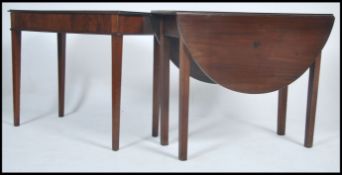 A Georgian mahogany console table being raised on square tapered legs with fitted frieze having