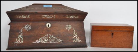 A 19th century Georgian rosewood and mother of pearl inlaid tea caddy having appointed interior