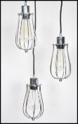 A set of three vintage industrial style droplet cage lights, each with fitted Edison Bulb, wire work