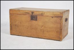 A vintage 20th century pine chest / storage trunk having lock to front with hinged top revealing a