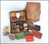 A good collection of vintage advertising / point of sale tins along with vintage leather wares to