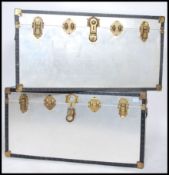 A good pair of large 20th century silvered panel steamer trunk chests, each with gilt metal clasps
