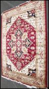 A large North Western Iranian / Persian Heriz carpet - rug having red and beige ground with