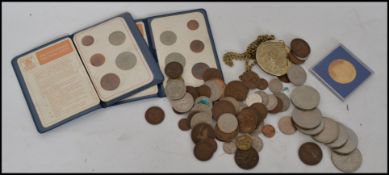 A collection of assorted coins dating from the 19th & 20th century to include British and