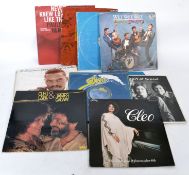 A collection of Lp's dating mainly from the 1980's in blue plastic carry crate. Artists to include