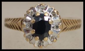A hallmarked  9ct gold sapphire and diamond cluste