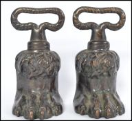A pair of believed Irish / Scottish 19th century Georgian bronze door stops in the form of hairy paw