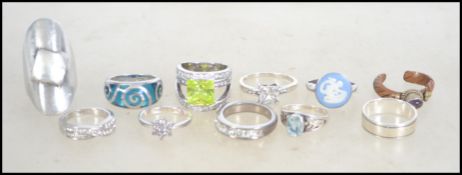 A collection of silver 925 rings to include modern, glass stone set, cameo set, claw mounted,