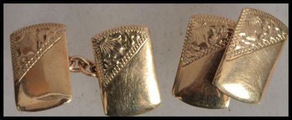A pair of hallmarked 9ct gold gentlemen's cufflinks of square form complete in original box. Weighs