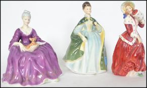 A collection of Royal Doulton figurines to include Christmas morn HN1992, Charlotte HN2421 &