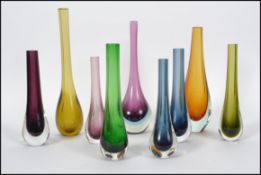 A collection of studio art glass vases, mainly sol