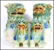 Two graduating pairs of Oriental ceramic Chinese Dogs of Foo / Fu / Temple Dogs  tallest measuring