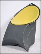 An original Flux folding envelope chair. The chair folding down for ease of storage with a drop in