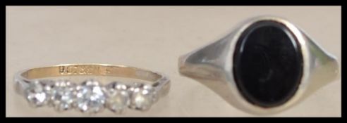 A 9ct gold ladies jewellery ring, with 6x clear stones, mounted in silver. together with a white