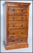 A  good quality antique style contemporary hardwood upright pedestal chest of drawers raised on