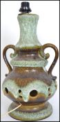 A retro 20th century twin handled West German table lamp of tall form having a speckled glazed