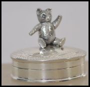 An unusual 20th century silver pill box with articulated bear to the top ( please see images )