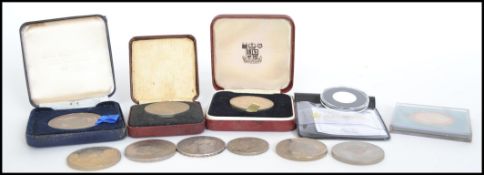 A collection of crown coins to include a George III 1919 Secundo crown, a Hallmarked silver