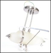 A retro style aeroplane ceiling lamp light having a frosted glass body with chrome metal