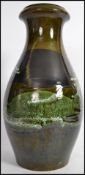 A tall West German Sheurich - Kermatik fat lava floor vase / stick stand on green ground over glazed