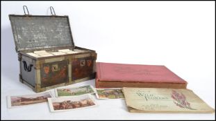 A collection of vintage cigarette cards dating from the early 20th century some in albums the