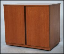 A retro 1970's Danish inspired teak wood hi-fi / side cabinet having doors to front with sectional