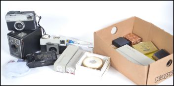 A mixed lot to include a group of vintage cameras to include a Brownie six 20 C, Kodax Instamatic
