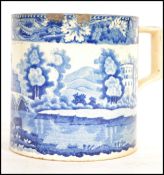 A 19th century blue and white Staffordshire mug having scene of ruined castle with cattle etc,