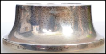 A silver hallmarked tea strainer / pin dish of molded tapering form being hallmarked for