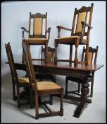 An Old Charm Jacobean revival oak draw leaf refectory dining table together with a set of Old