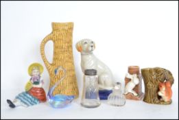 A group of ceramics to include; a West German vase (254-25), a sylvac vase depicting a squirrel
