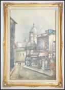A large gilt framed continental oil on canvas painting of a Parisian street scene study with