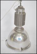 A vintage industrial large ceiling factory pendant light with half moon shade in the manner of
