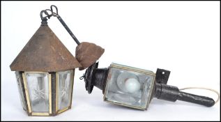 A Chinese brass hanging lantern having etched glass panels along with a Victorian carriage lamp
