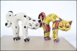 Two Lorna Bailey ceramic pottery cats in arched stretching positions both signed one limited edition
