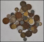 A collection of coins dating from the 19th century from around the world and British Isle's to