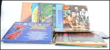 A collection of long play records to include various artists such as Pink Floyd, Yes, Santana,