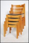 A set of 4 beech and vinyl upholstered stacking ch