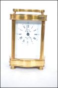 A brass cased carriage clock with roman numeral chapter ring with the dial marked for L'Eipe - Saint