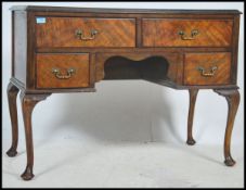 A 1930's Queen Anne revival walnut writing desk being raised cabriole legs having drawers flanking a