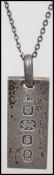 A hallmarked silver ingot pendant on a sterling silver 925 necklace chain. Hallmarked for London
