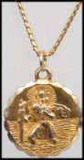 A 9ct gold St Christopher pendant and necklace, the verso of the pendant with car and plane being
