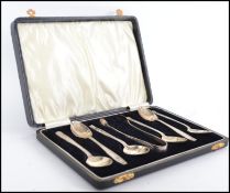 A set of silver hallmarked teaspoons and sugar nips complete in the presentation case. Hallmarked