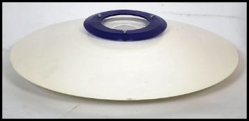 A Danish style metal UFO ceiling light shade together with a large red metal domed ceiling light.