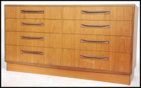 A retro 1970's G-Plan teak wood Kelso double chest of drawers having recessed lozenge shaped handles
