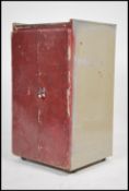 A vintage mid 20th century industrial work cupboard tool cabinet. Constructed from metal with a